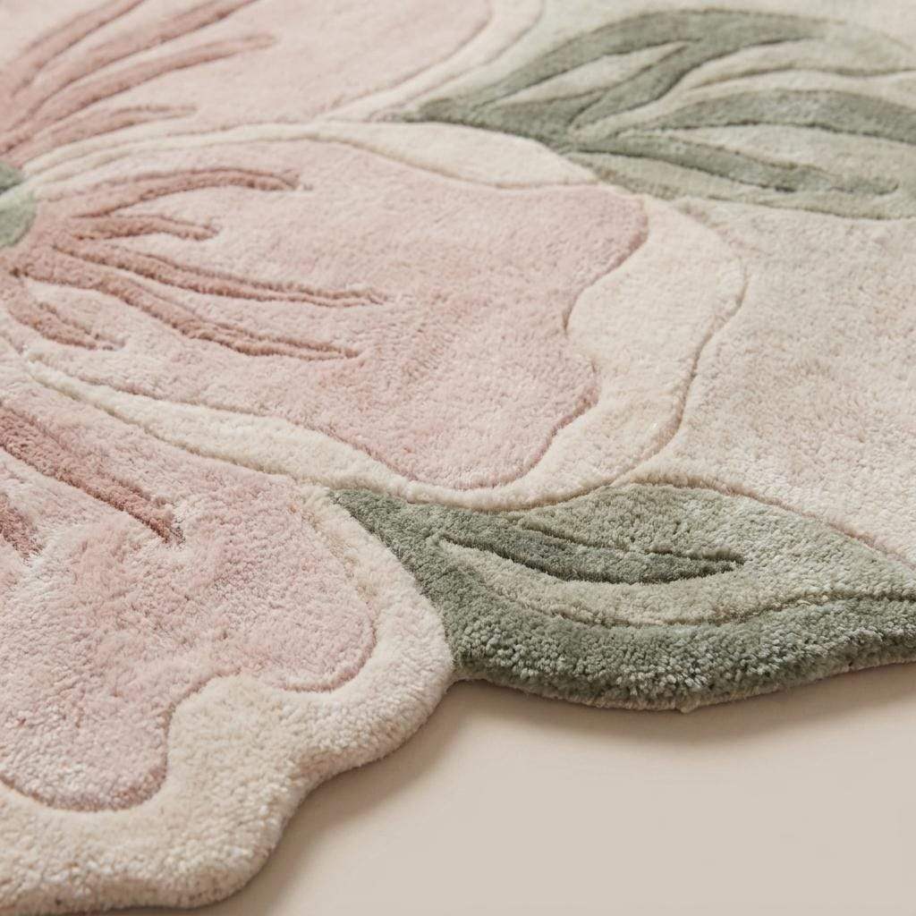 Close-up of hand tufted wool rug showing carved floral texture, soft cut pile, and raised botanical detailing __etsy:8022433516