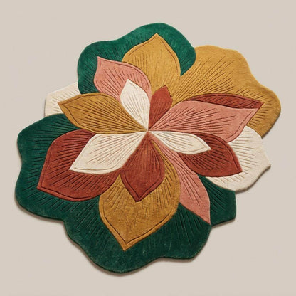 Modern botanical carpet with oversized flower design placed on wooden flooring beside curved cream furniture and natural sunlight __etsy:8053832919