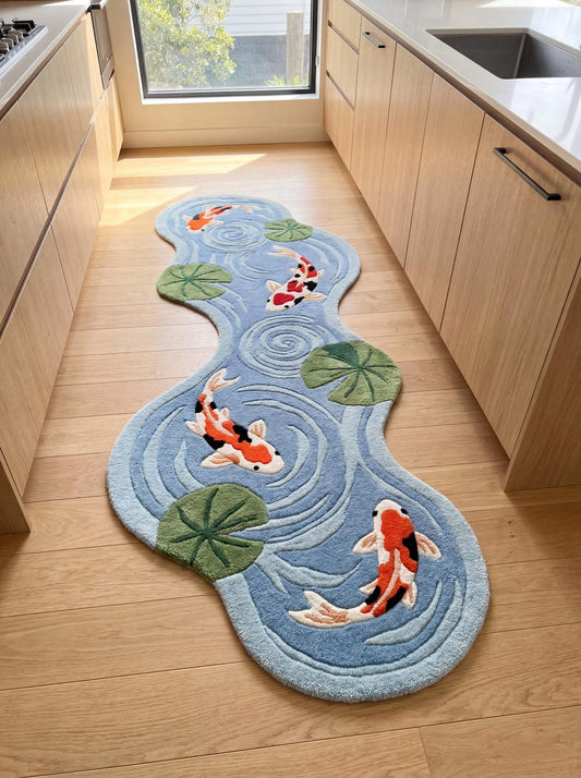 Hand tufted koi fish runner rug with blue pond water ripple design and lily pads placed in modern kitchen interior __etsy:7840770353