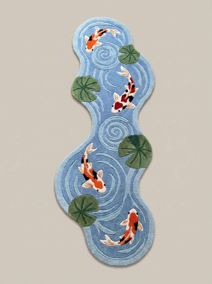 Irregular shaped koi pond runner rug with orange koi fish and green lily pads on light blue background __etsy:7792839408