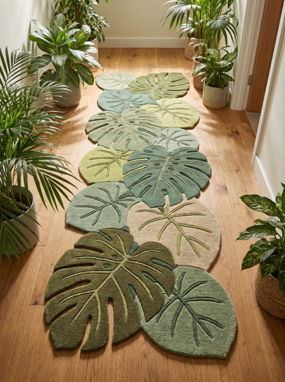 Hand tufted botanical runner rug featuring layered monstera leaf shapes in sage and olive green tones for hallways and entryways __etsy:8140751727