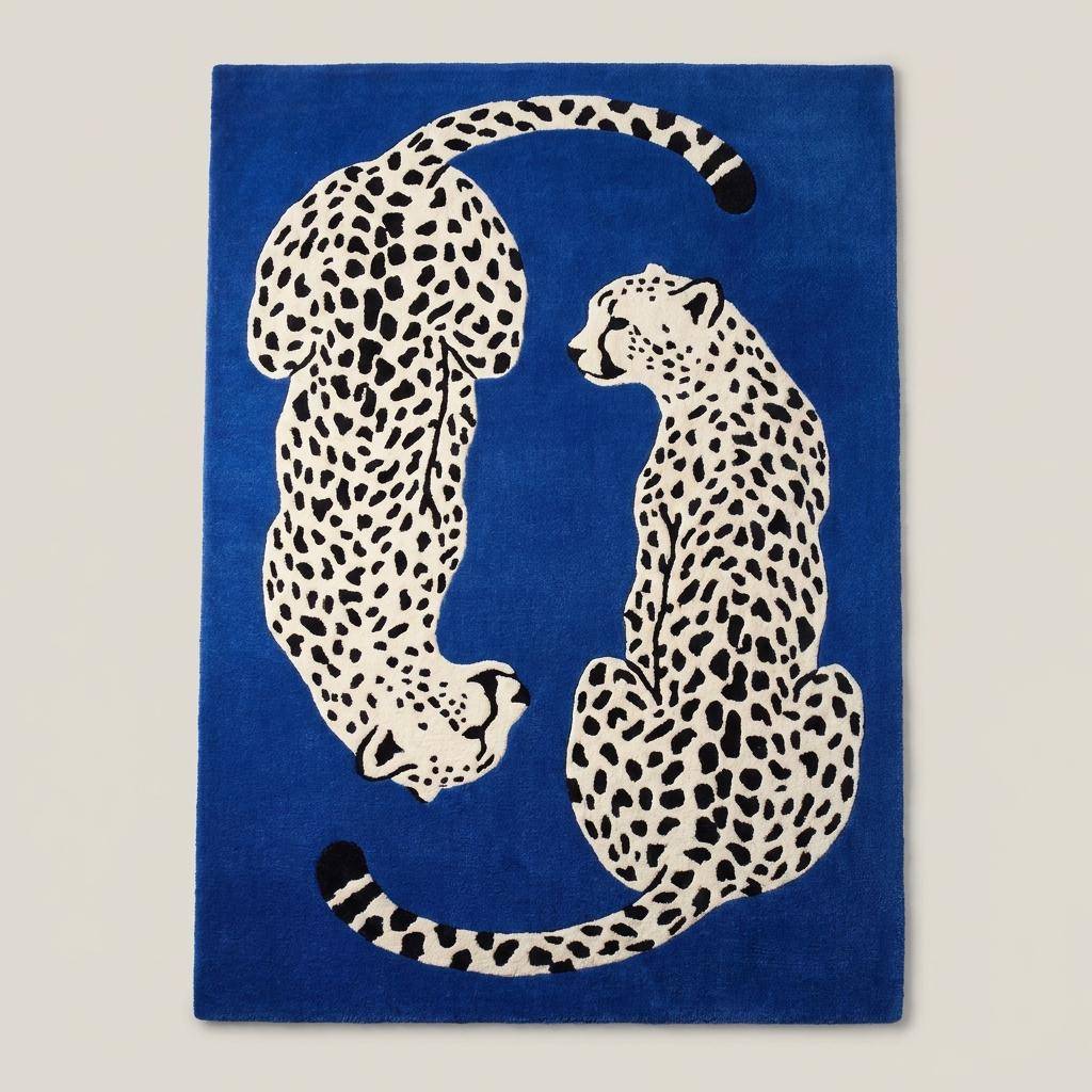 Contemporary animal print area rug with twin leopard design styled beside a blue accent chair and minimalist wall art. __etsy:8131774399
