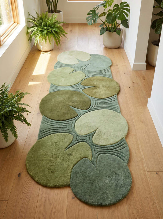Hand tufted green runner rug featuring organic lily pad shapes arranged across a botanical hallway design in multiple shades of sage and moss green. __etsy:8092987674