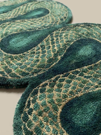 Close-up of hand tufted wool pile showing carved snake scale texture with dense green fibers and beige detailing __etsy:7792857382