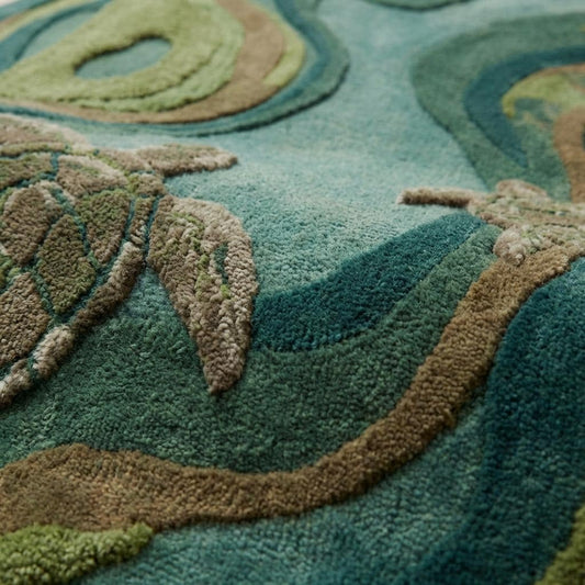 Close up of dense hand tufted wool pile showing carved high-low texture and soft natural fiber surface