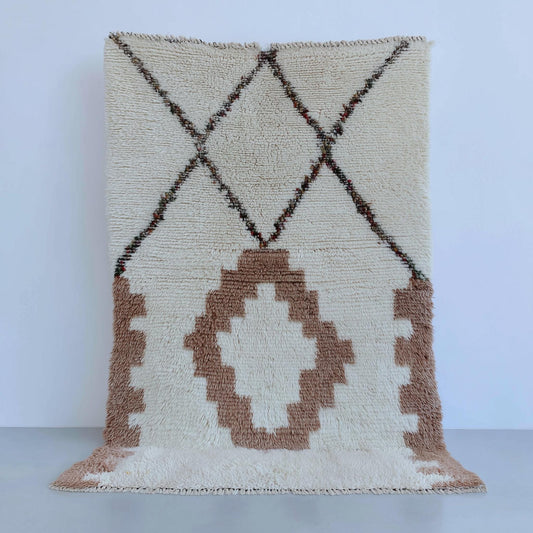 Hand-tufted wool area rug with modern Moroccan geometric pattern in ivory and beige tones