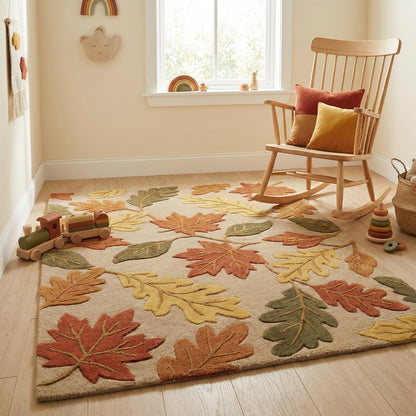 Hand tufted wool autumn leaf rug with carved floral design in rust, mustard, and olive tones on beige background