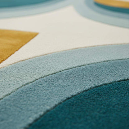 Hand-tufted wool rug with mid-century teal and mustard arc design on cream background