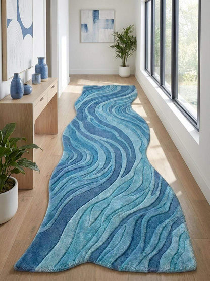 Contemporary blue carpet runner with sculptural edges and layered wave motifs creating movement and visual depth. __etsy:8140856581