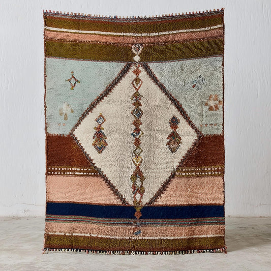 Hand-woven Moroccan wool rug with blush pink and sage Berber design