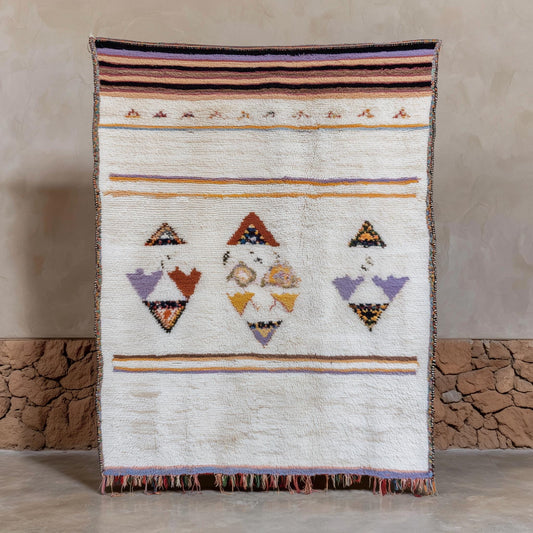 Hand-loomed blush pink wool rug with Moroccan tribal kilim design and pastel boho accents