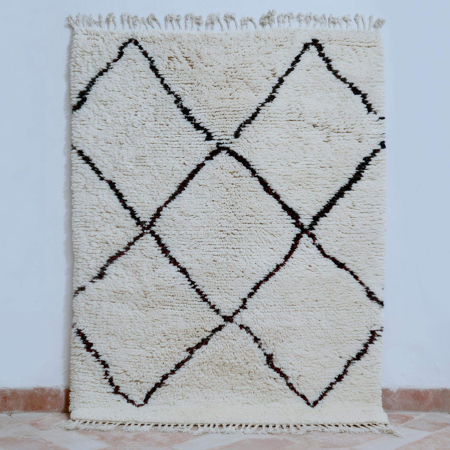 Handcrafted Beni Ourain style wool rug with ivory shag, dark diamond Berber design, perfect for boho and Scandinavian interiors