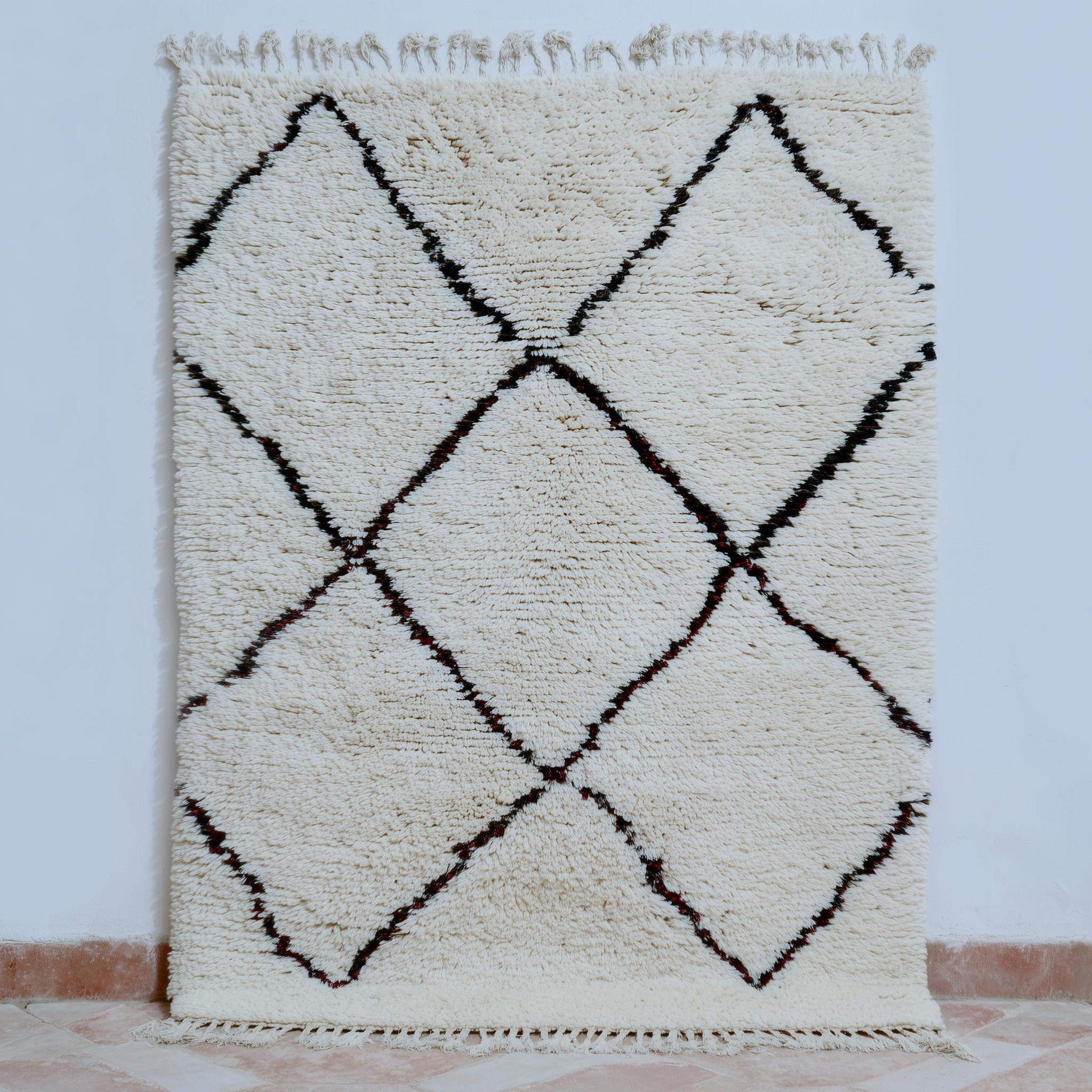 Handcrafted Beni Ourain style wool rug with ivory shag, dark diamond Berber design, perfect for boho and Scandinavian interiors