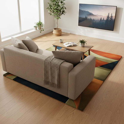 Handmade retro rug with curved geometric pattern in burnt orange, olive green, navy, and amber gold wool tufted carpet