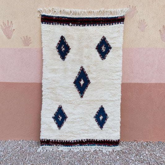 Handmade Moroccan Beni Ourain Rug with indigo diamond pattern on ivory background