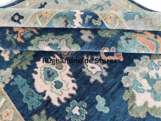 Handmade Oushak wool rug in blue and gray with traditional Turkish knot and intricate floral design