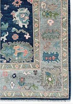 Handmade Oushak wool rug in blue and gray with floral Turkish knot design for living room decor
