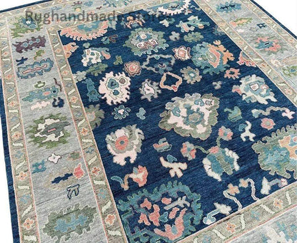 Handmade Oushak wool rug in blue and gray with intricate floral Turkish knot design, perfect for living room decor