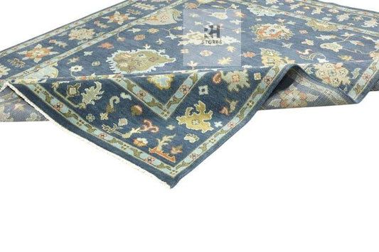 Handmade Oushak wool rug in olive green, beige, and gray with intricate floral Turkish knot design for living room decor