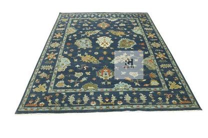 Handmade Oushak wool rug in olive green, beige, and gray with intricate floral Turkish knot design