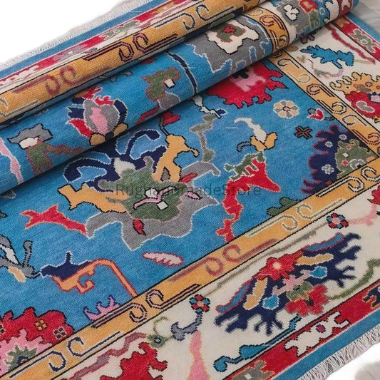 Handmade Oushak wool rug in dark blue with floral Turkish knot design, 8x10 area rug