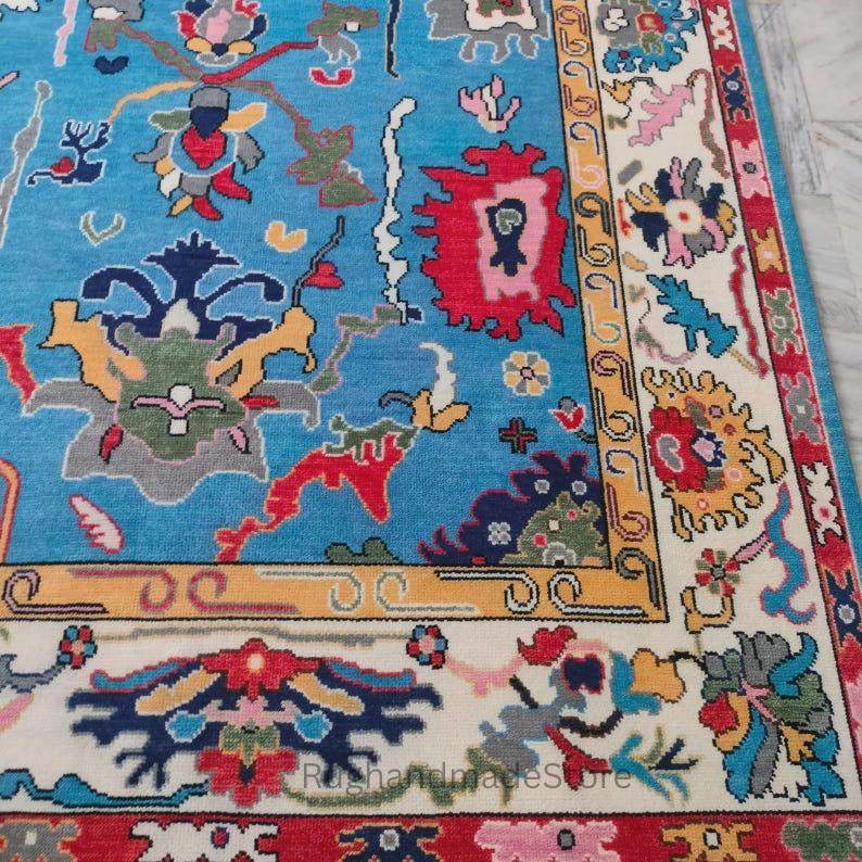 Handmade Oushak wool rug with dark blue Turkish knot design in 8x10 size
