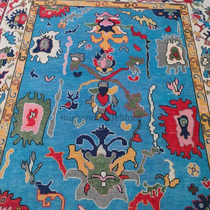 Handmade Oushak wool rug in dark blue with floral Turkish knot design, 8x10 area rug