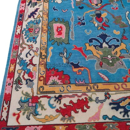 Handmade Oushak wool rug with dark blue floral Turkish knot design, 8x10 area rug