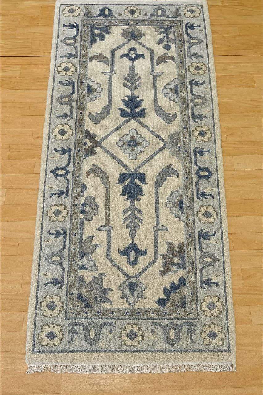Handmade Oushak wool runner rug in ocean blue, green, and ivory floral design, 2.6x7 ft, with orange accents