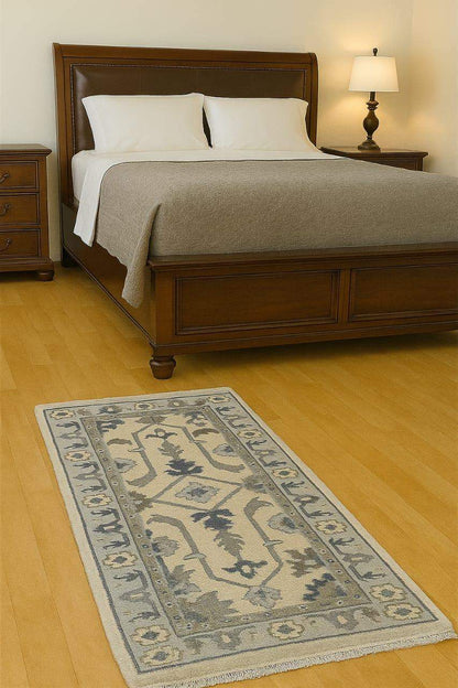 Handmade Oushak wool runner rug with ocean blue, green, ivory floral design, 2.6x7 ft, wool and orange accents.