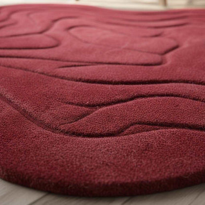 Handmade tufted red rug with modern 3D wave design and irregular shape