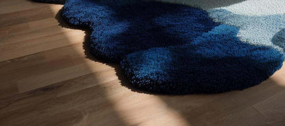 Handmade wool tufted rug with modern white and blue floral design, 6x9 area carpet for home decor