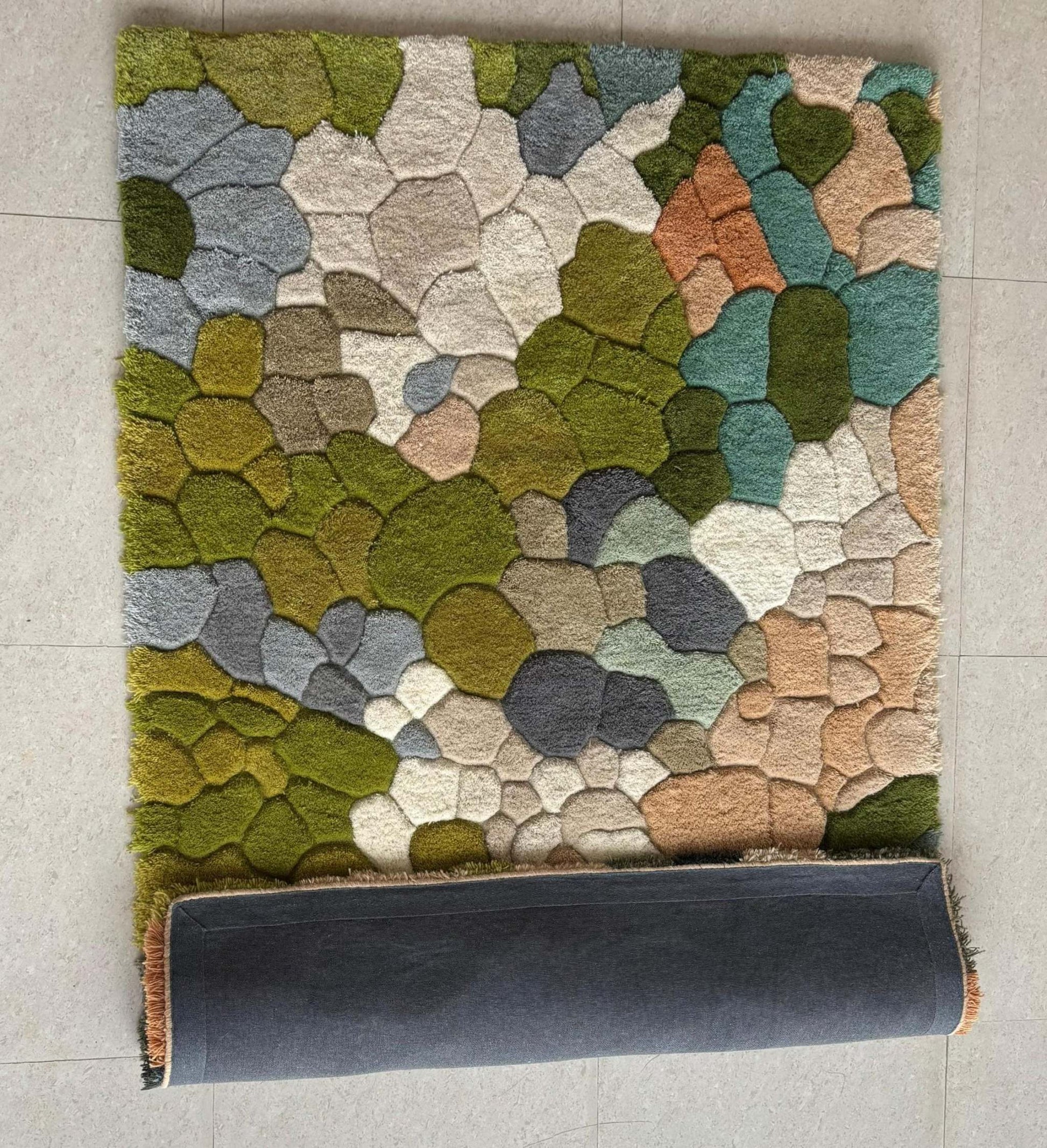 Handmade wool tufted moss rug with nature-inspired forest floor design, soft and cozy rectangular carpet for living room and kids playroom decor
