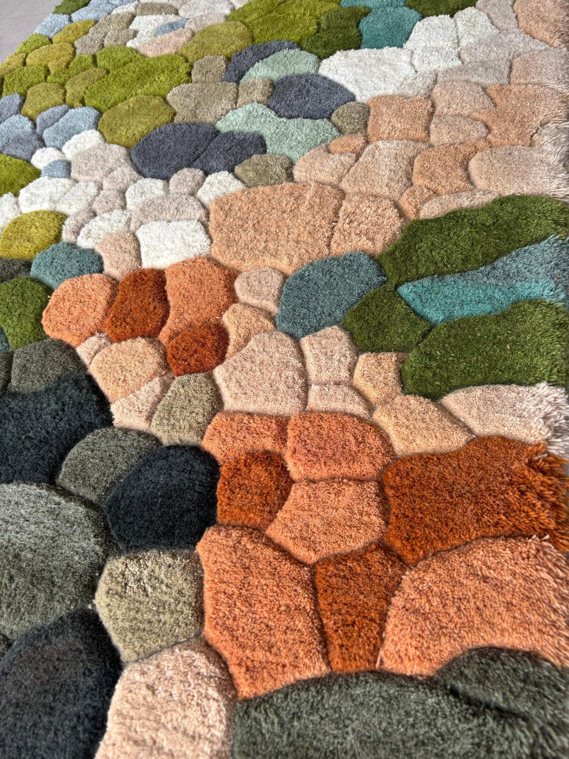 Handmade wool tufted moss rug with nature-inspired forest floor design, rectangular shape, muted colors, and cozy texture for living room or kids playroom decor