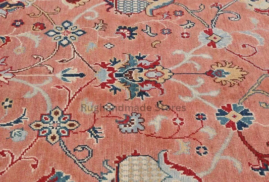 Handmade wool Turkish knot rug with pink and yellow Oushak floral design in 8x10 area size