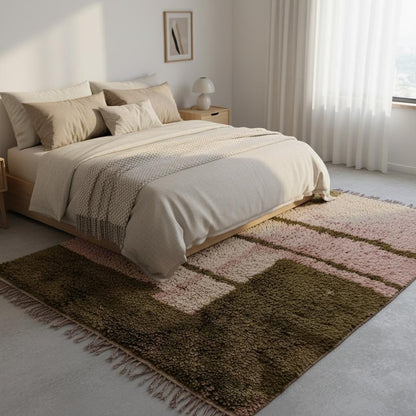 Dusty-pink handwoven wool rug with olive geometric motif and fringe, styled in minimal studio — statement living room rug, rugs rug carpet teppich.