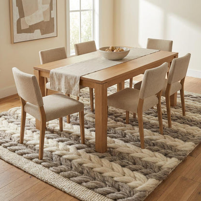 Handwoven chunky wool braided rug in neutral tones with thick texture for farmhouse and Scandinavian decor