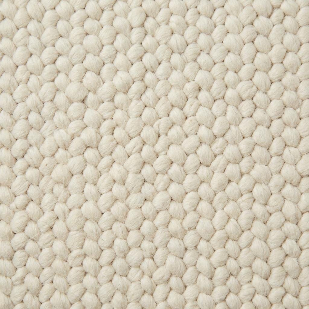 Handwoven chunky wool rug in cream with thick knit texture for Scandinavian home décor