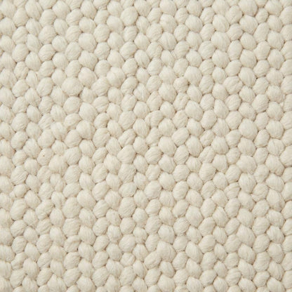 Handwoven chunky wool rug in cream with thick knit texture for Scandinavian home décor