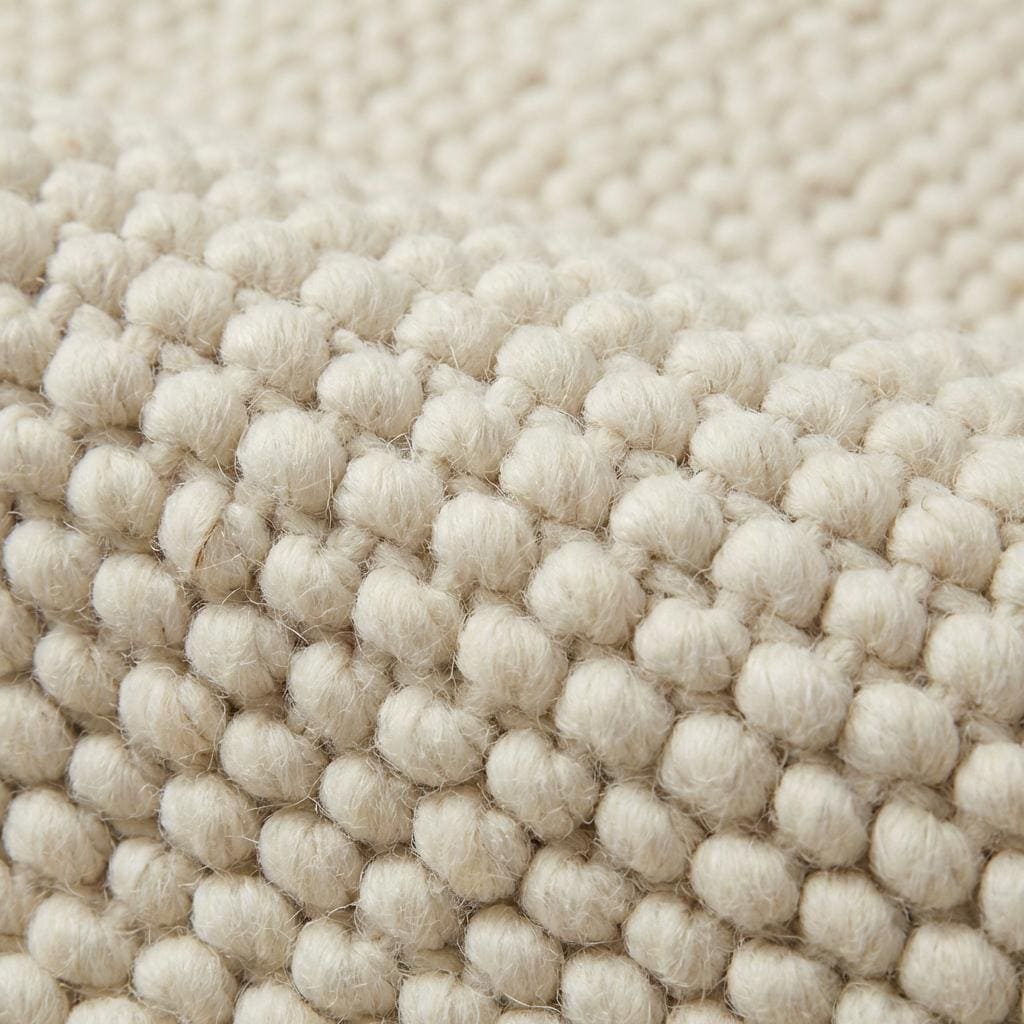 Handwoven chunky cream wool rug with thick knit texture for cozy Scandinavian decor