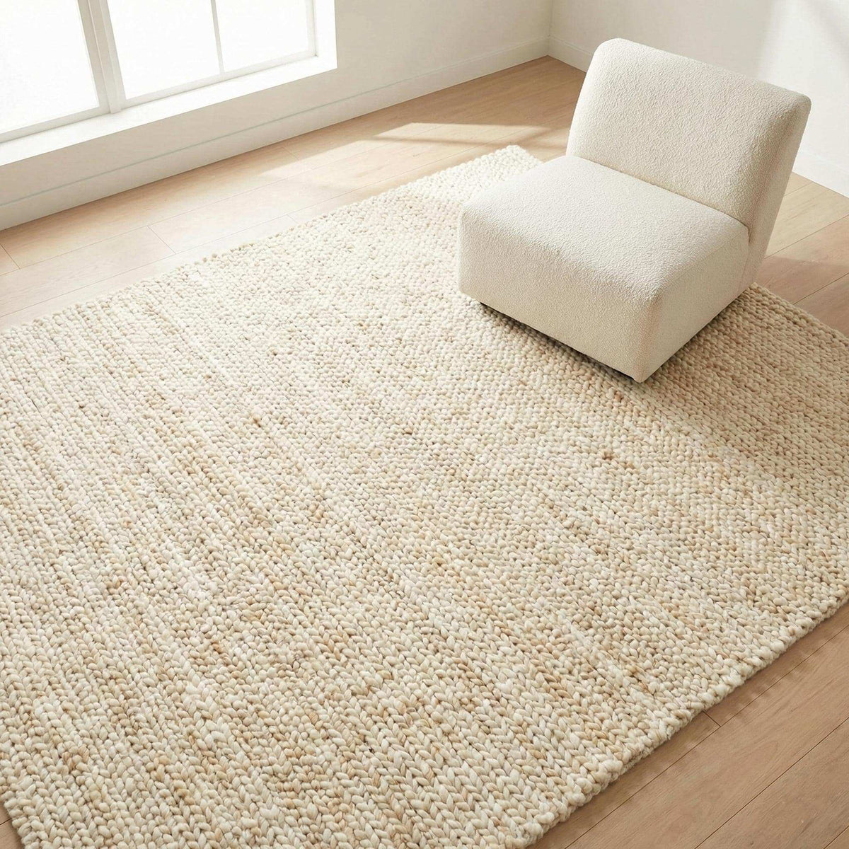 Handwoven chunky wool rug in cream with thick texture for Scandinavian and modern interiors
