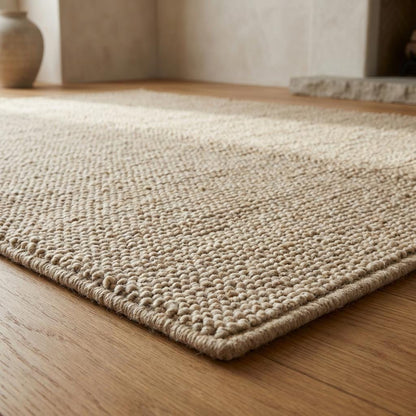 Handwoven chunky wool rug with thick looped texture in neutral beige for cozy farmhouse decor