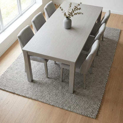Handwoven chunky wool rug in neutral gray with thick texture for Scandinavian farmhouse decor