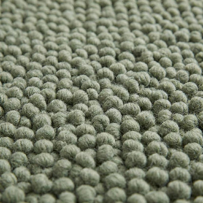 Handwoven chunky wool rug in neutral tones, cozy Scandinavian home decor piece