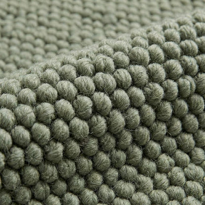 Handwoven chunky wool rug with thick texture in neutral tones for Scandinavian home decor