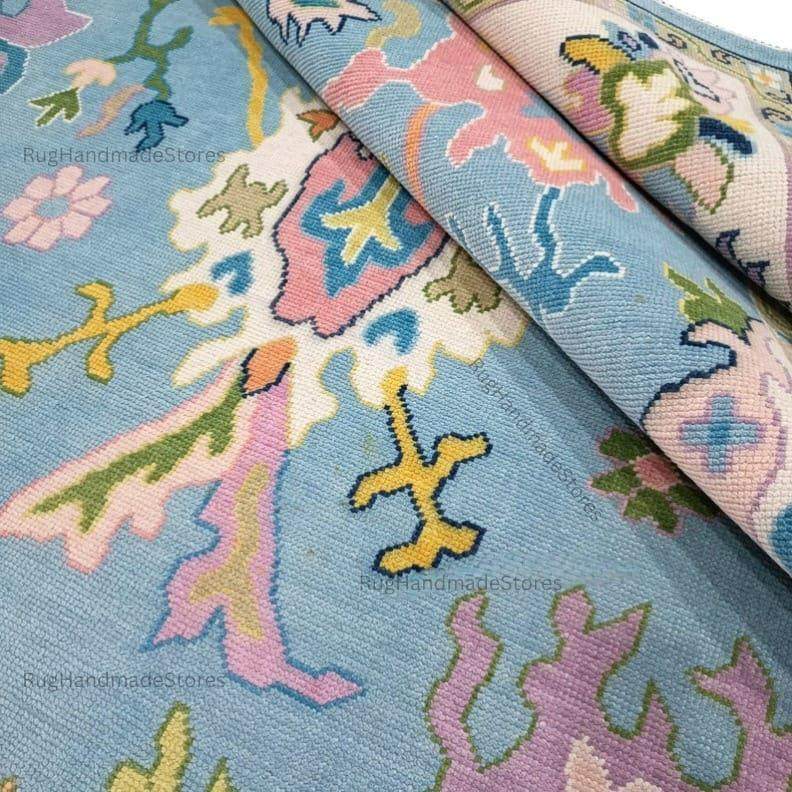 Handwoven Oushak rug with sky blue, aqua, and mustard floral design, Turkish boho style, rectangular, hand-knotted wool carpet for living room decor
