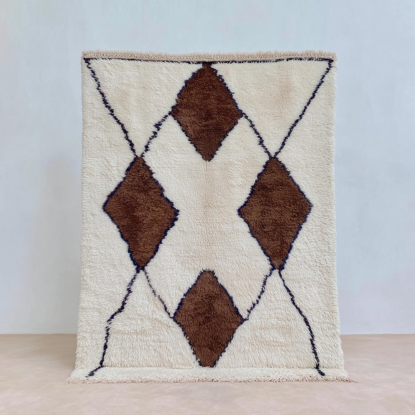 Handwoven Wool Beni Ourain Rug with ivory background and brown diamond motifs, plush Moroccan wool area rug