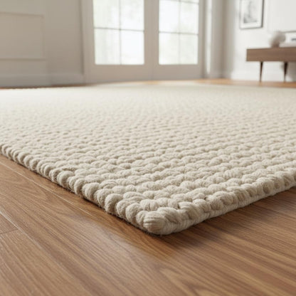Minimalist wool rug with soft loop pile design, crafted for modern cozy interiors