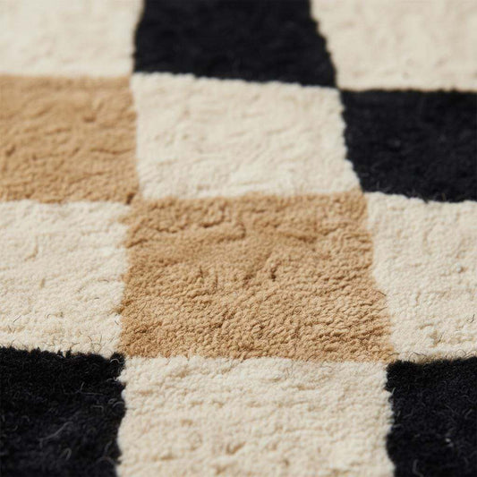 Close-up of hand-tufted plush pile rug showing soft fibers, dense texture, and checkerboard craftsmanship detail __etsy:7592842026