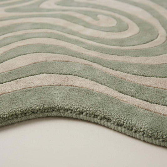 Close-up of hand tufted rug showing plush high pile texture, soft fibers, and dense craftsmanship